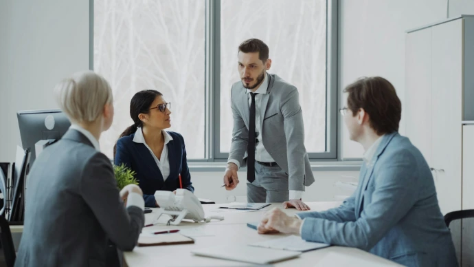 Business professionals in a meeting around a table